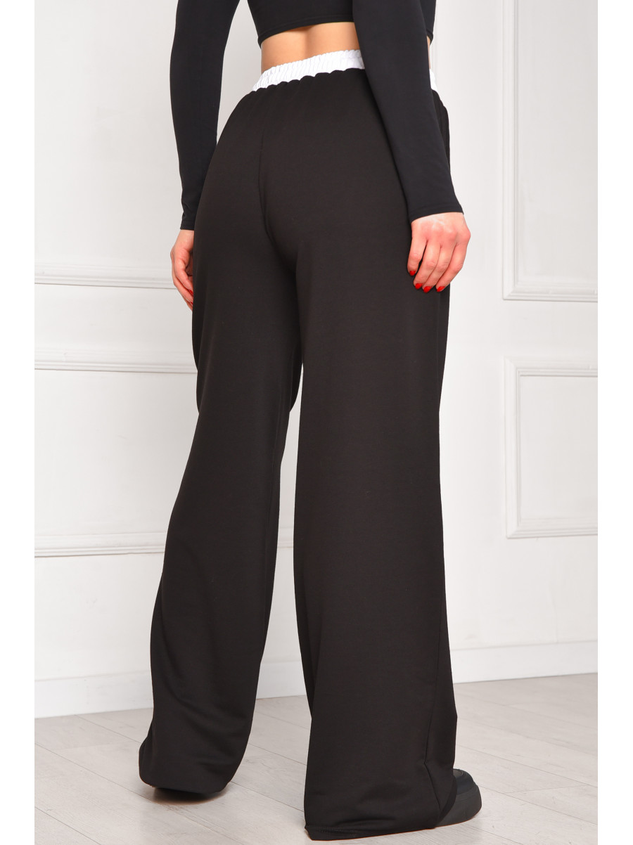 Спортивные штаны женские однотонные черного цвета 7129 208617C