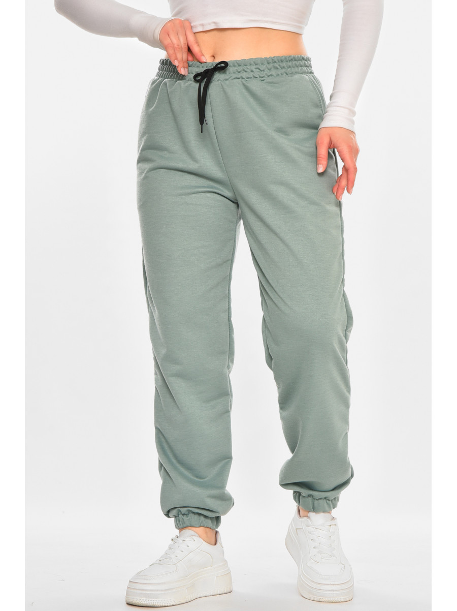 Спортивні штани жіночі напівбатальні однотонні зеленого кольору 212817C