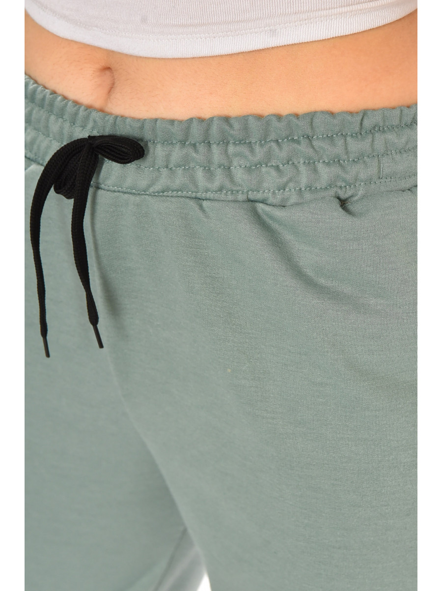 Спортивні штани жіночі напівбатальні однотонні зеленого кольору 212817C